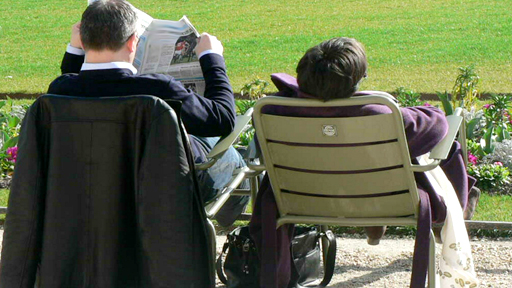 reading the paper in the park