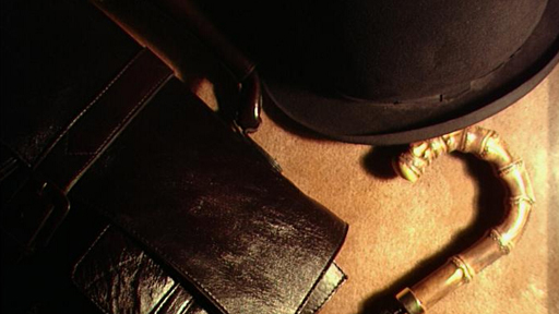 umbrella, bowler hat and leather briefcase