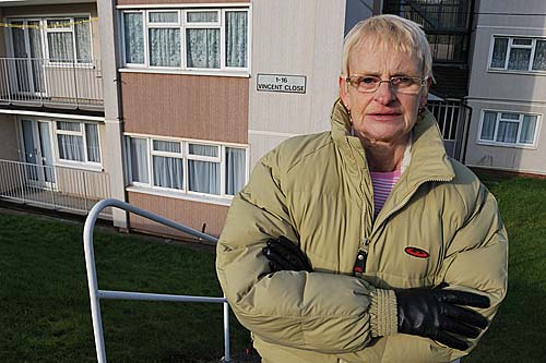 Silla Carron stands outside the block of flats in The Estate We're In