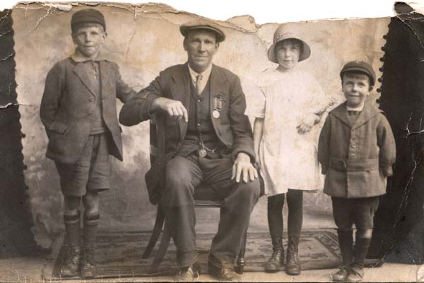 A Century Of Fatherhood: left to right - Alec Haines with his dad, brother and sister