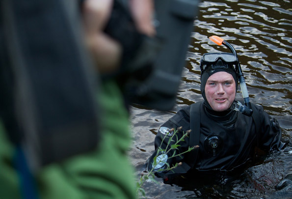 Charlie Hamilton James in a river