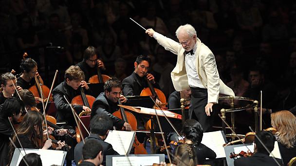 Photo of John Adams conducting at the Proms