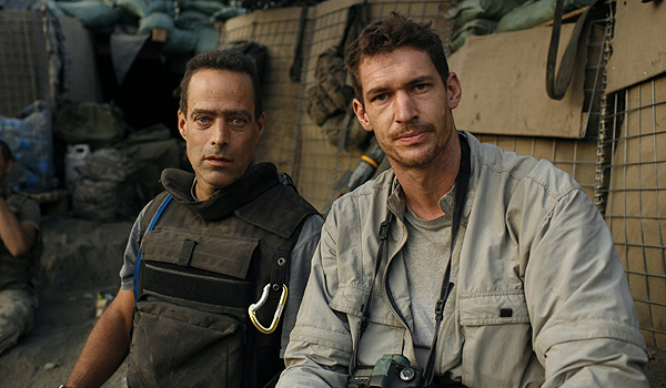 Photographer Tim Hetherington (R) and writer Sebastian Junger are shown in this undated handout image during an assignment for Vanity Fair Magazine at 