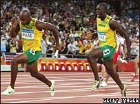 Usain Bolt passes baton to Asafa Powell
