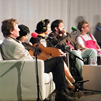 Presenter Clare English on stage with the cast of 'The World According to Bertie' and Chinese Classical guitarist Xuefei Yang