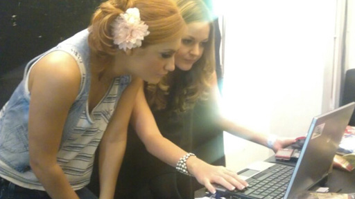 Aliona Vilani checks her schedule backstage