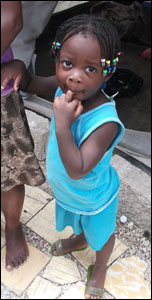 child holding mother's hand (photo by Gemma Handy)
