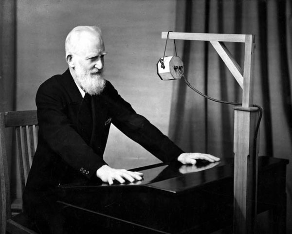 George Bernard Shaw at a microphone in 1931