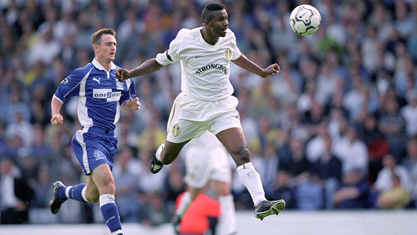 Former Leeds United and South Africa captain Lucas Radebe heads the ball away from Everton striker Franny Jeffers in a Premier League match in 2000.