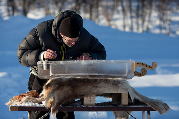 One of the volunteers helping carve the ice at the Norwegian Ice Music Festival.