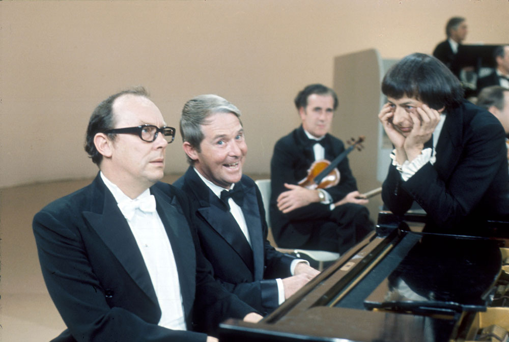 Eric Morecambe, Ernie Wise and André Previn on 'The Morecambe and Wise Christmas Show' in 1971.