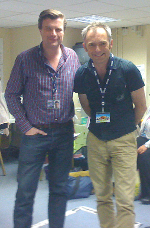 Photo of Petroc Trelawny in the production office with Charles Hazlewood 
