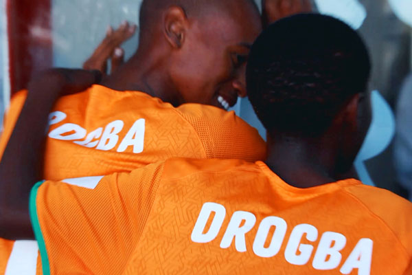 Two young Ivory Coast fans, complete with Didier Drogba shirts, look forward to the World Cup in a shot from the BBC's World Cup marketing promo