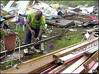 A Grenadian resident picking up the pieces after the passage of Hurricane Ivan