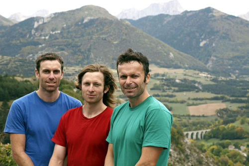 Ben, Sam, and Danny pose in front of The Alps