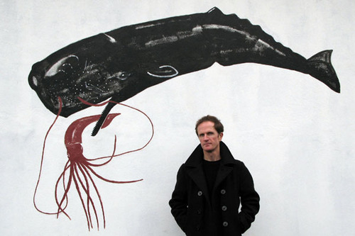 Previous Samuel Johnson Prize winner Philip Hoare stands in front of a whale mural, on the BBC Arena show about his novel, Leviathan.
