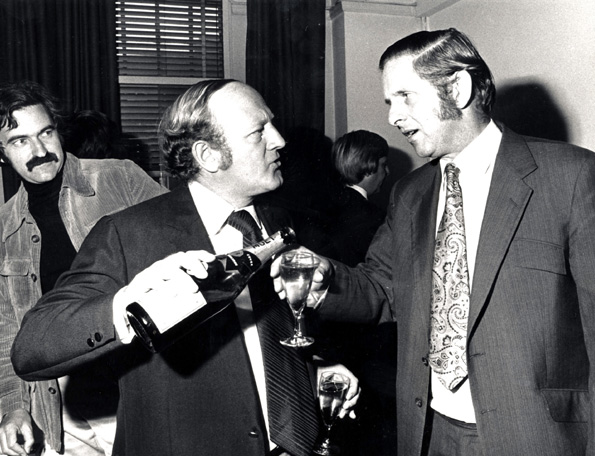 Robert Robinson pours a drink for co-presenter John Timpson at Robert Robinsons farewell breakfast party