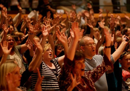 Audience raising hands