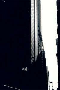 Flag illuminated on the side of one of the New York skyscraper