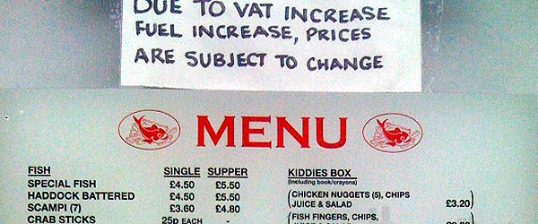 A menu in a take-away with a sticker at the top that reads: Due to VAT increase, fuel increase, prices are subject to change