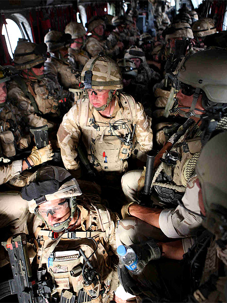 The sound of the propellers is loud, the cabin is warm...and even if I wanted to speak with someone the troops are too focused for idle chit-chat