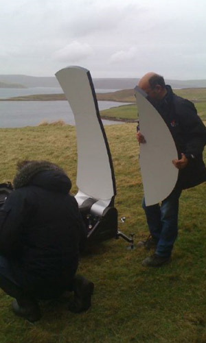 A satellite dish being put together