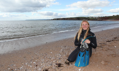 Maya Plass on the beach by Scott Tibbles