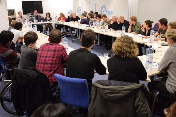 The cast sit in the read through