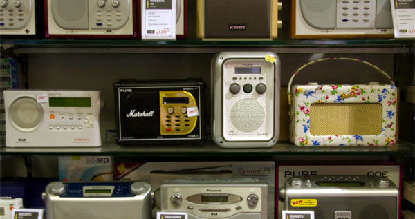 An array of digital radios on display in a shop.