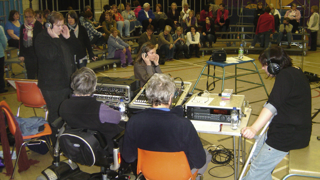 MD, Sally McLean (right), listens to a take.