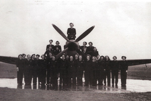 An archive picture of the women of the ATA in front of a plane