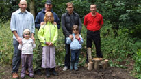 Family planting a tree
