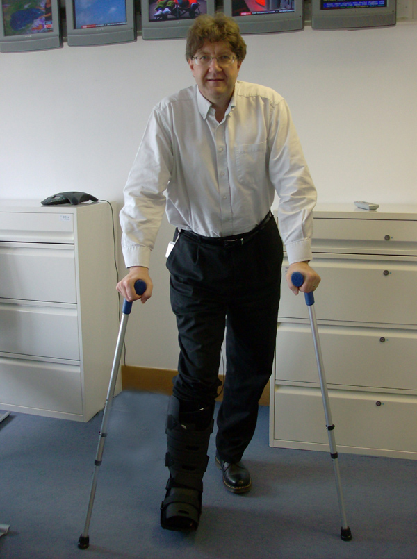 Mark Byford with a broken leg