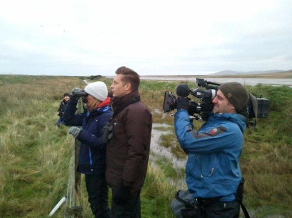 Chris Packham, Micheala Strachan and film crew watching geese on Islay