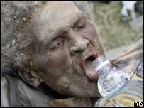 Rescued woman drinks water