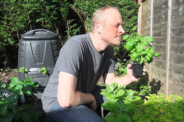 Richard Cadey in his herb garden