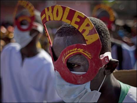 man with mask saying cholera