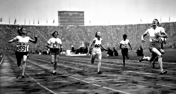 Fanny Blankers-Koen of the Netherlands finishes first in the Women's 100m during the XIV Olympic Games 