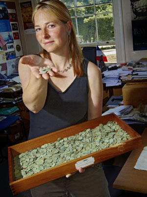 Dr Alice Roberts with some of the Roman coins excavated from Frome