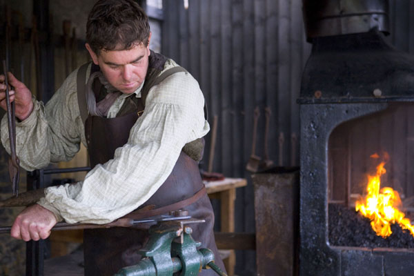 Simon the Ironmonger at work in the Victorian forge