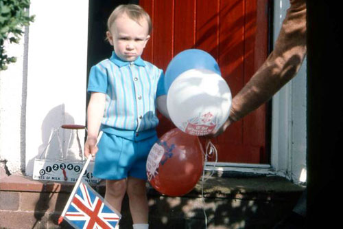 Dominic Sandbrook as a child in the 1970s, holding his Silver Jubilee balloons