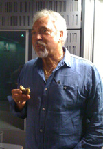 Tom Jones eating a Welsh Cake in the Desert Island Discs studio.