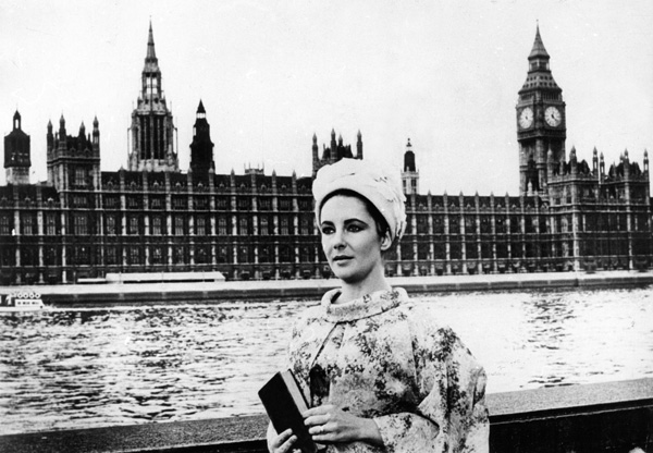 Elizabeth Taylor in front of the River Thames and Houses Of Parliament