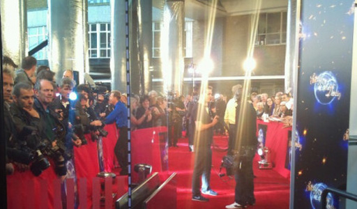 The papparazzi checking their photos as the celebs and dancers head into Television Centre. 