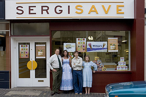 Karl Sergison and his family outside the grocer's shop in the 1970s era