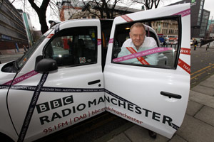 Alan Beswick, BBC Radio Manchester breakfast presenter, in his 'takeover taxi'.