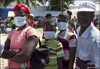 People wait in line at the hospital St. Nicholas in St. Marc, Haiti