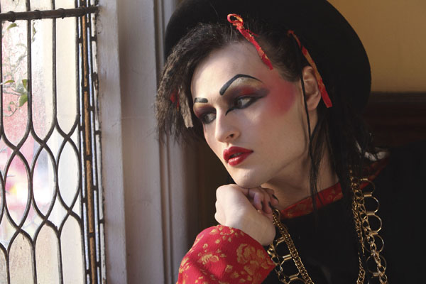 Douglas Booth as Boy George stares out of a window in Worried About The Boy