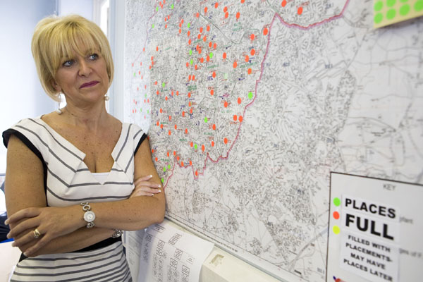 Head of admissions and appeals at Birmingham City Council Julie Newbold stands by a map of her area