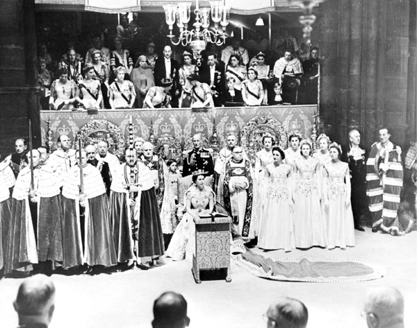 Queen Elizabeth II (C) sits in Westminster Abbey, 02 June 1953 on her coronation day in London.